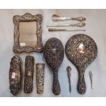 A COLLECTION OF REPOUSSE SILVER DRESSING TABLE ITEMS