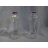 A PAIR OF EDWARDIAN SILVER-MOUNTED GLASS VASES