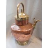 A LARGE COPPER AND BRASS KETTLE