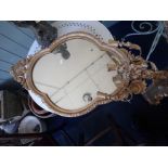 A GILTWOOD AND COMPOSITION GIRANDOLE MIRROR