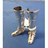 A PAIR OF SILVER RIDING BOOTS