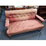 A VICTORIAN OPEN-ARMED SOFA