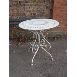 A WHITE PAINTED METAL GARDEN TABLE