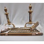 A PAIR OF BRASS FIRE DOGS AND A SET OF BRASS STAIR RODS