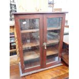 A SMALL VICTORIAN GLAZED MAHOGANY CABINET