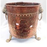AN EMBOSSED COPPER LOG BUCKET WITH LION HEADS