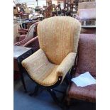 AN 'X' FRAME UPHOLSTERED CHAIR