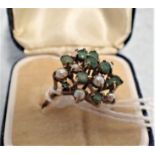 A 9CT GOLD EMERALD AND PEARL CLUSTER RING