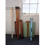 A VINTAGE DRAWING BOARD WITH THREE WOODEN TRIPODS