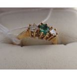 AN 18CT GOLD EMERALD AND DIAMOND RING