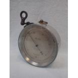 A METAL-CASED ANEROID BAROMETER, BY STANLEY, LONDON