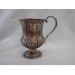 A CONTINENTAL WHITE METAL REPOUSSE MUG