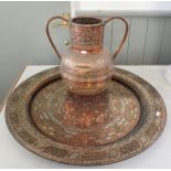 A PERSIAN COPPER TWO-HANDLED POT