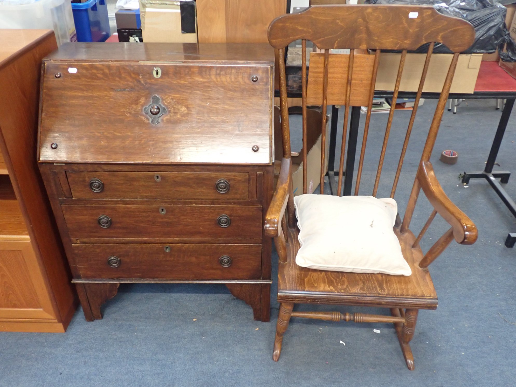 A 20TH CENTURY BUREAU AND A STAINED ROCKING CHAIR