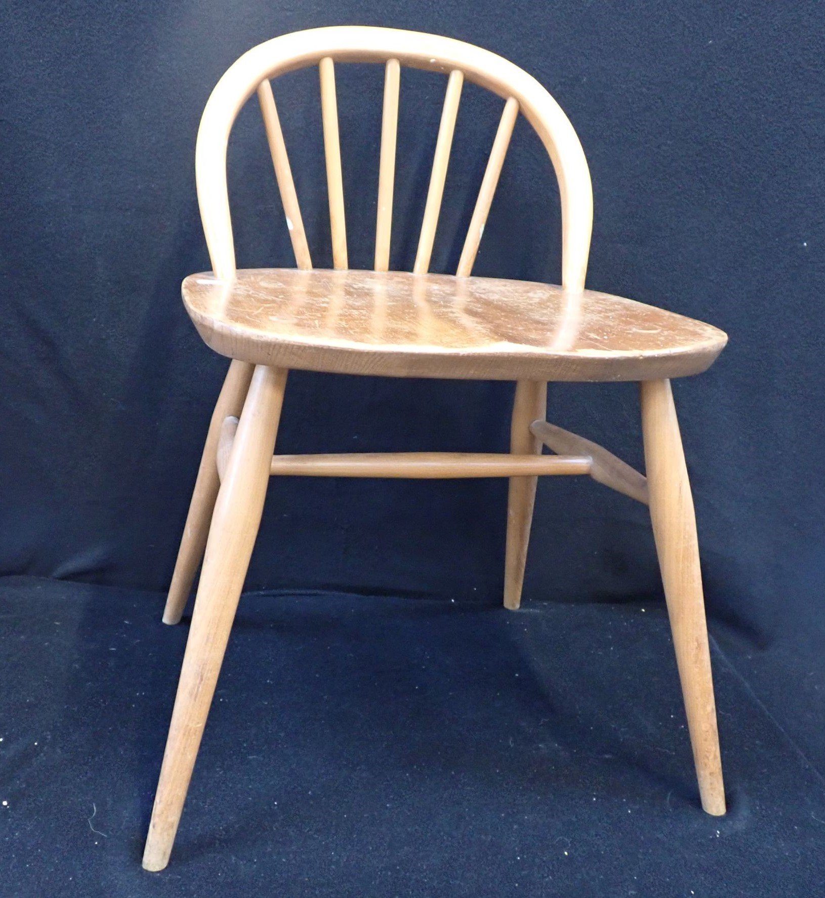 AN ERCOL LOW-BACKED DRESSING/DESK CHAIR, MODEL 414