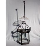 AN EDWARDIAN HEXAGONAL METAL FRAMED HALL LANTERN