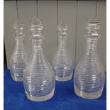 FOUR REGENCY CUT GLASS DECANTERS, OF RIBBED DESIGN