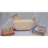 A CHILD'S WOODEN TOY DUCK