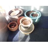 A COLLECTION OF TURQUOISE AND TERRACOTTA PLANTERS