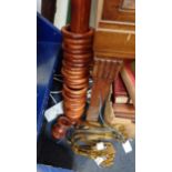 A VICTORIAN STYLE STAINED PINE CURTAIN POLE AND RINGS