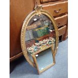 A SMALL PAINTED AND GILT WALL MIRROR