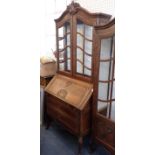 A FRENCH PROVINCIAL CARVED OAK BUREAU BOOKCASE