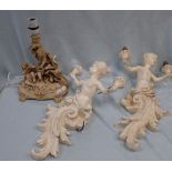 TWO CHERUB WALL LIGHTS AND A SIMILAR TABLE LAMP