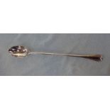 A LONG HANDLED SILVER SPOON