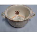 A 19TH CENTURY TWO-HANDLED 'MARRIAGE' CHAMBER POT