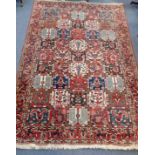 A LARGE PERSIAN DESIGN RUG