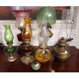 A COLLECTION OF OIL LAMPS