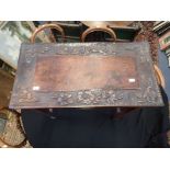 A MAHOGANY SIDE TABLE WITH CARVED TOP