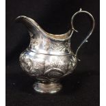 A GEORGE III BALUSTER MILK JUG