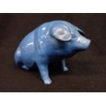 AN EWENNY POTTERY PIG, BLUE GLAZED