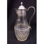 A VICTORIAN SILVER MOUNTED CLARET JUG