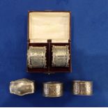 A CASED PAIR OF SILVER NAPKIN RINGS