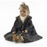French composite doll with jointed limbs in traditional dress, 54cm high