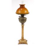 Gilt metal mounted alabaster oil lamp with glass shade, 82.5cm high