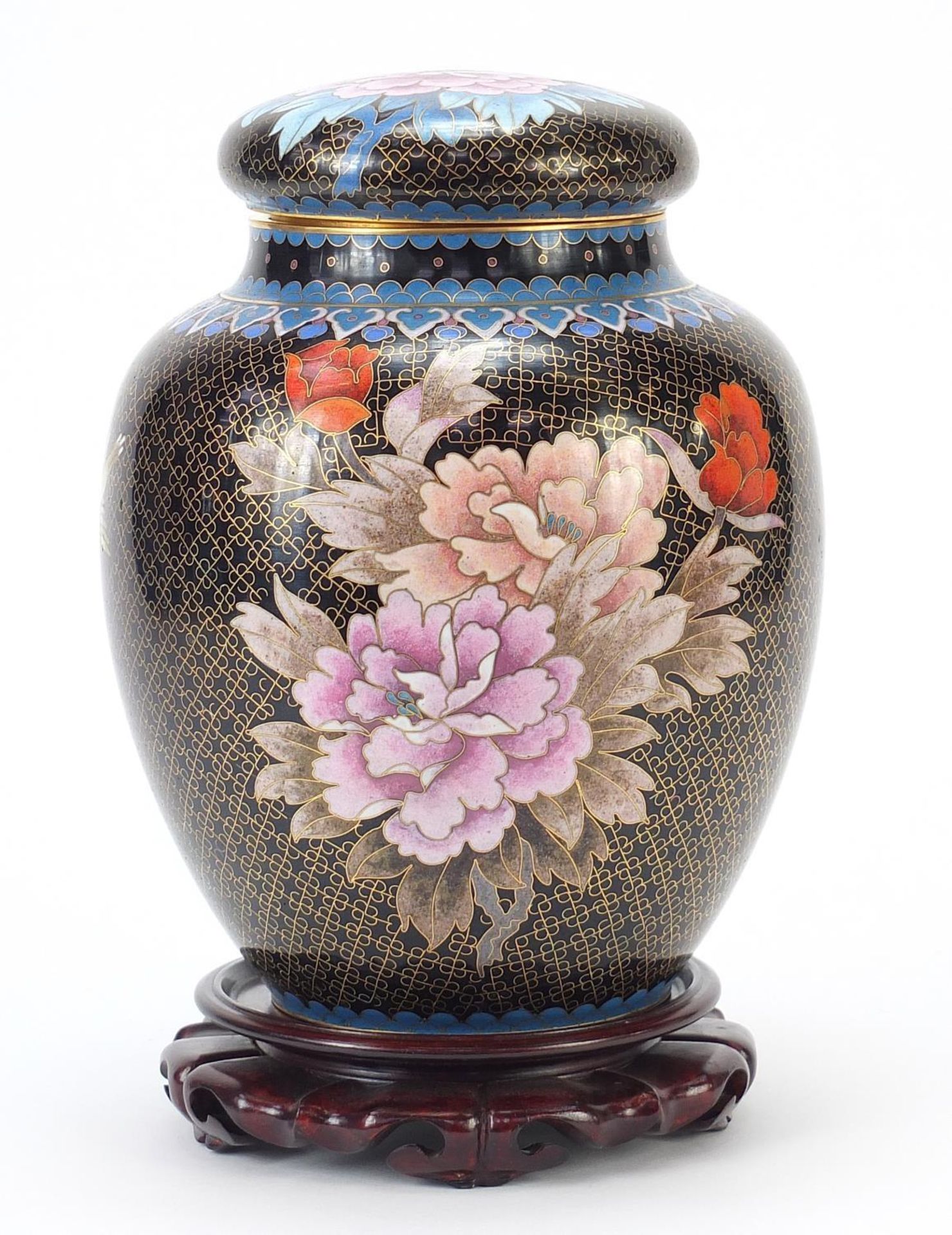 Large Chinese cloisonné ginger jar and cover enamelled with flowers, raised on a carved hardwood