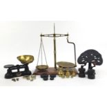 Vintage kitchenalia and a pair of brass balance scales including cast iron salt and pepper mills and