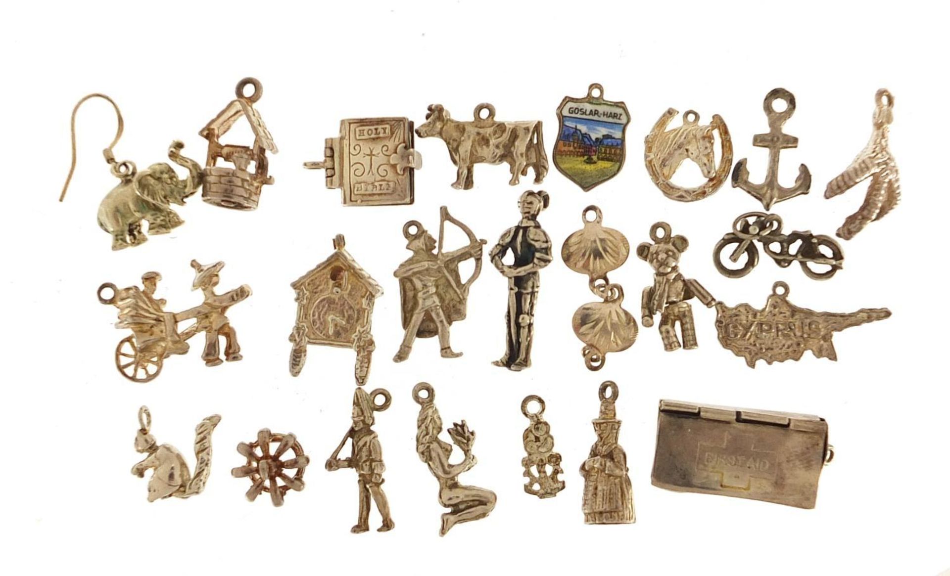 Collection of silver charms including Rupert Bear, hinged first aid box, vintage motorcycle,