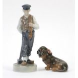 Royal Copenhagen shepherd boy with hammer and a Dachshund numbered 620 and 3140, the largest 21.