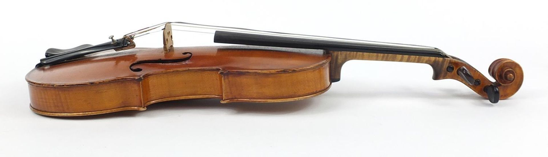 Old wooden violin bearing an Andre Castagneri paper label, the violin back 14 inches in length - Image 4 of 10