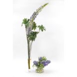 Two glass vases with artificial flowers, the largest 130cm high including the flowers, the largest