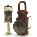 19th century silver plate candle lamp and a railway lantern with ceramic burner, the largest 31cm
