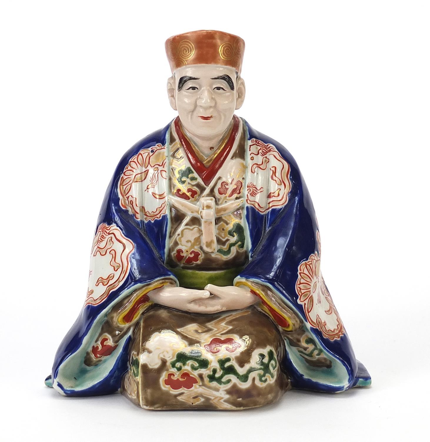 Japanese porcelain figure of a seated robed man, 17cm high - Image 2 of 7