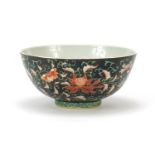 Chinese porcelain bowl hand painted in the famille noir palette with flower heads amongst