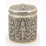Burmese sterling silver Betel box and cover profusely embossed with deities amongst foliage, 10cm