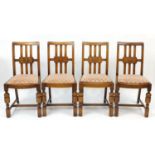 Set of four oak dining chairs with upholstered drop in seats, each 91cm high