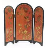 Japanese black lacquered screen gilded with birds and butterflies amongst flowers, inscribed paper